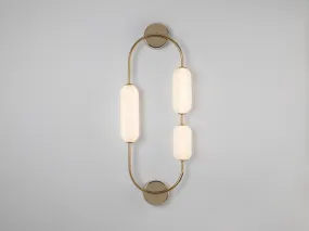 Brass oval pill wall light